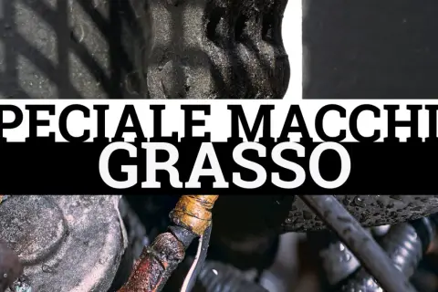 Dettaglio di componenti meccanici con macchie di unto evidenti. Testo "SPECIALE MACCHIE GRASSO".