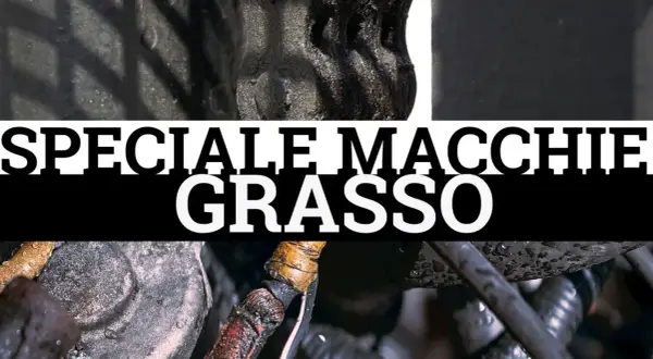 Dettaglio di componenti meccanici con macchie di unto evidenti. Testo "SPECIALE MACCHIE GRASSO".