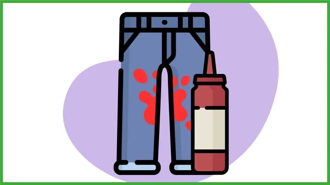 Un paio di jeans macchiati di rosso, forse da un incidente con il pomodoro. Accanto, una bottiglia di ketchup.